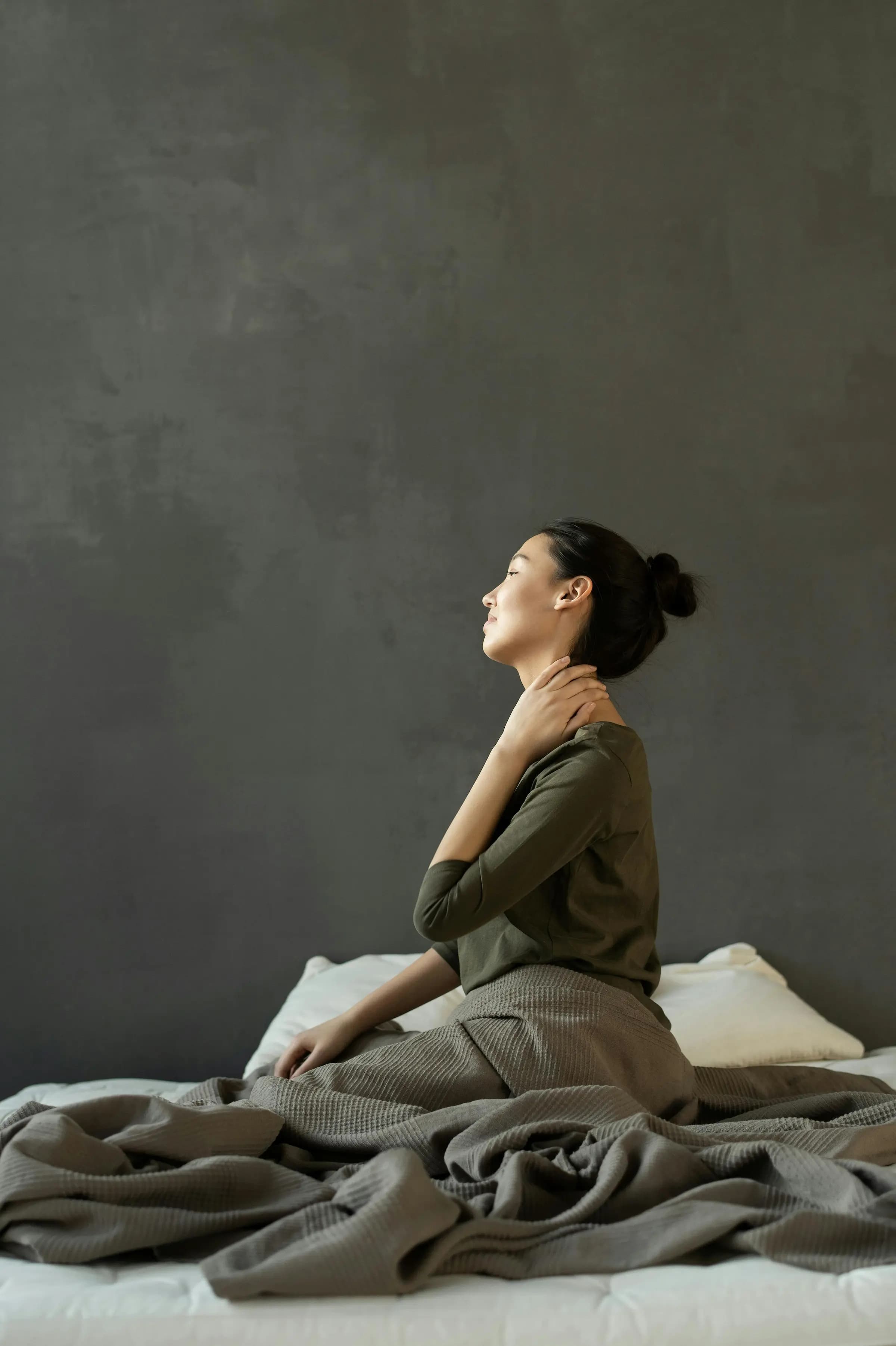 Woman strentching her neck while relaxing